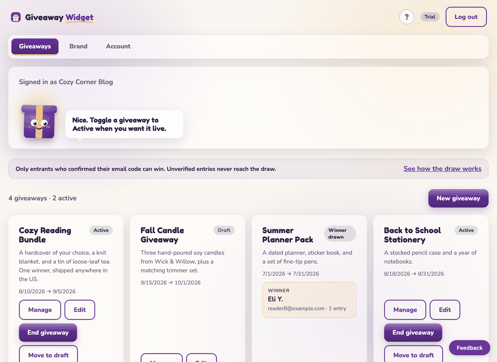 The Giveaways section of the dashboard: Gus the gift box mascot, a daily tip, and four giveaway cards marked Active, Draft, Winner drawn, and Active